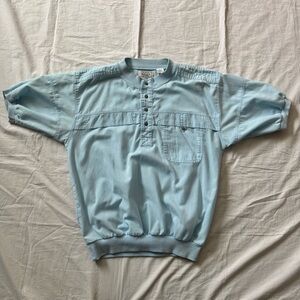 Vintage 80s/90s light blue polo/pull on shirt, short sleeve, buttoned pocket
